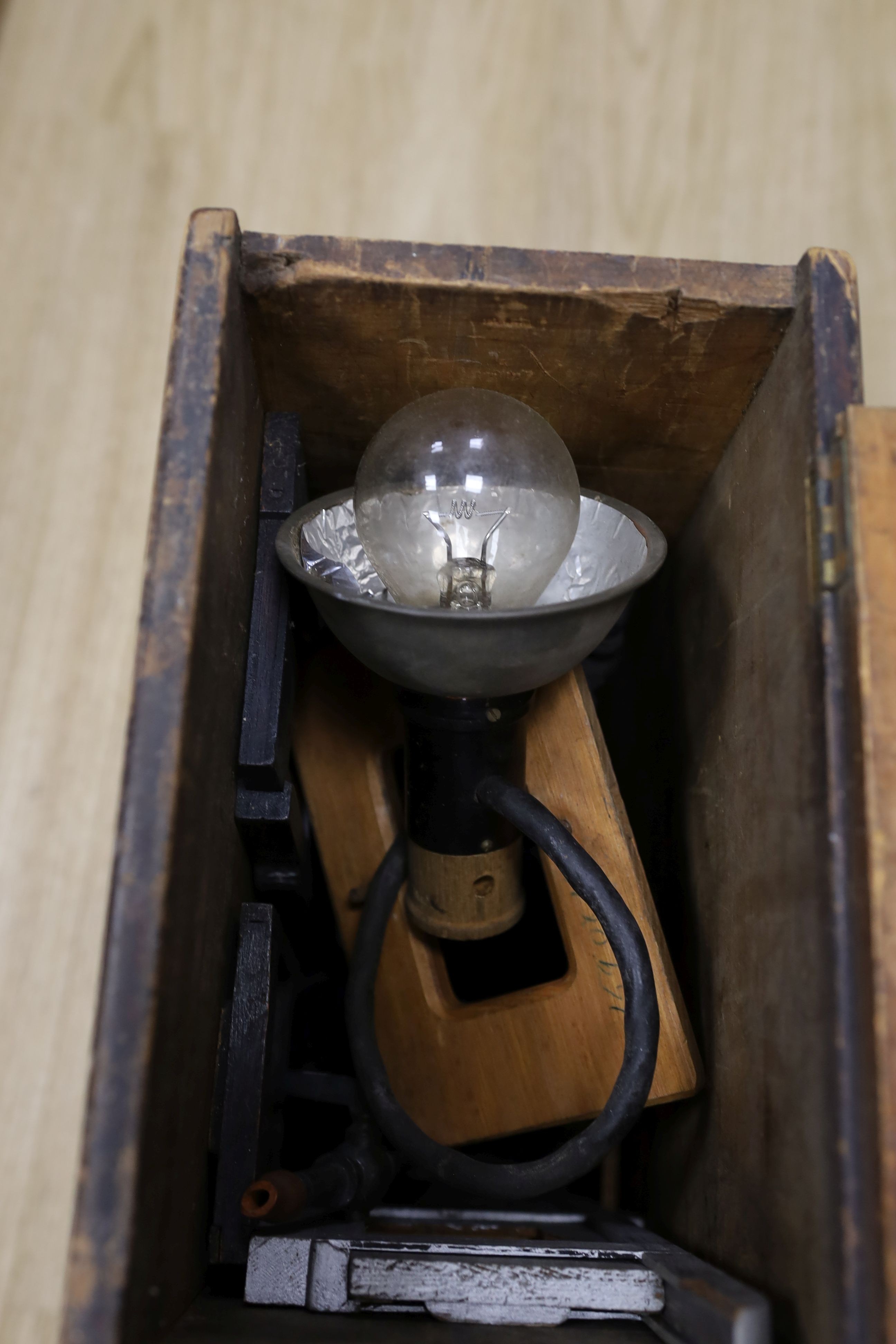 A late 19th century Magic lantern, cased with slides